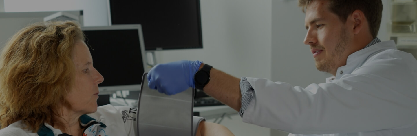 Medical professional assisting a woman during a clinical study session
