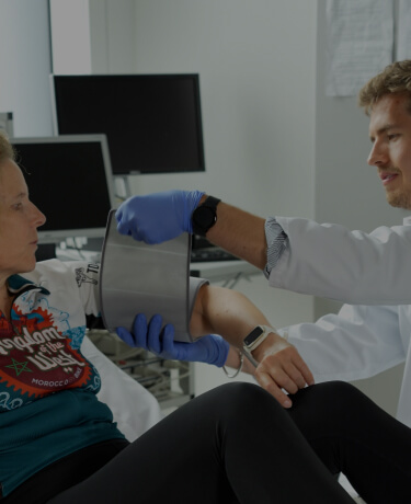 Medical professional assisting a woman during a clinical study session